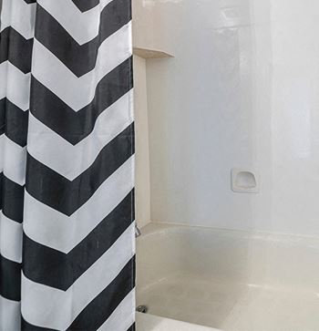 a bathroom with a shower and a bathtub